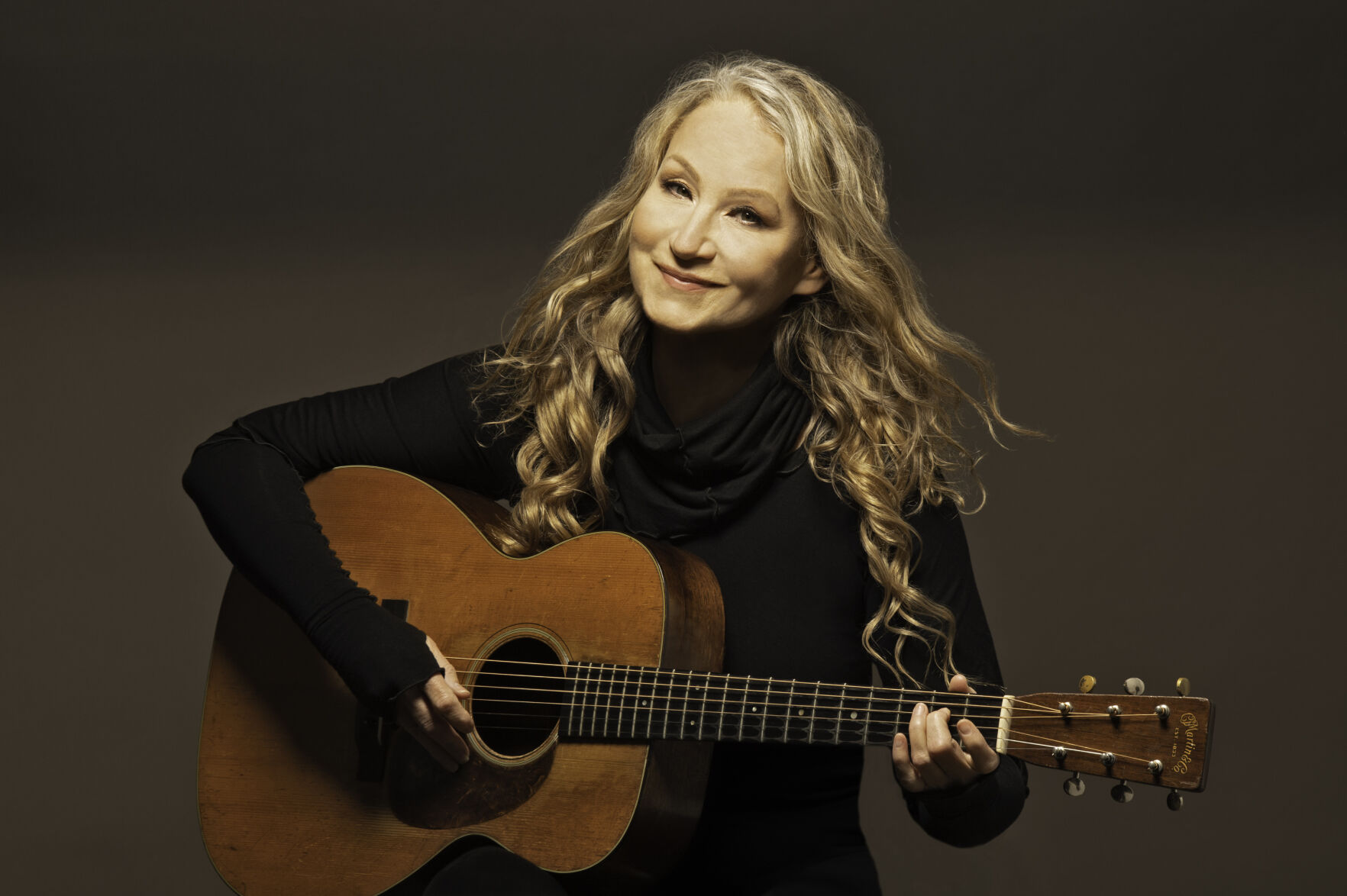 woman playing guitar